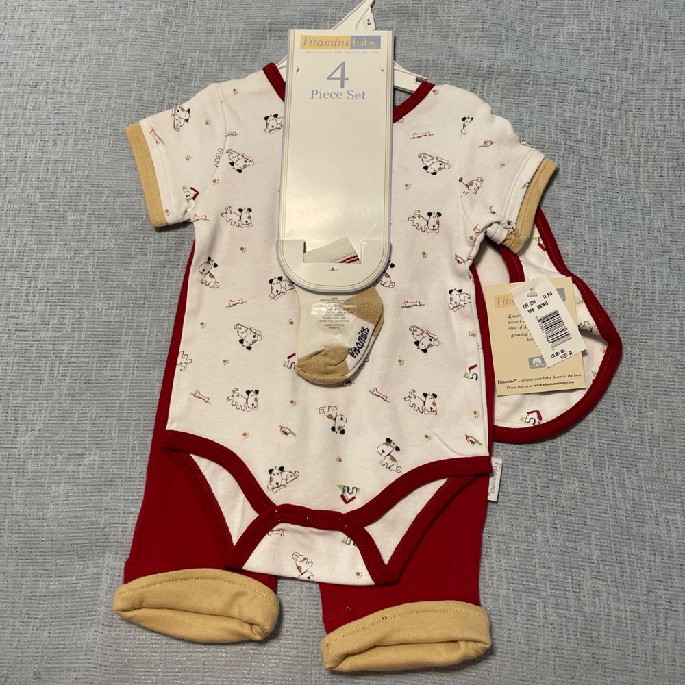 Vitamins Baby 4-piece set. Onesie, pants, socks, bib. Dog & bone design.
